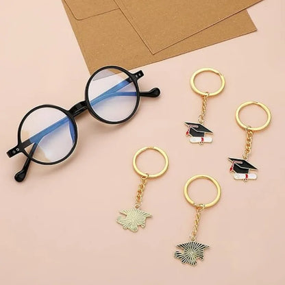 20 Graduation Gifts: Graduation Cap-shaped "Happy Graduation" Keychains. Metal material, suitable for graduation/school return g
